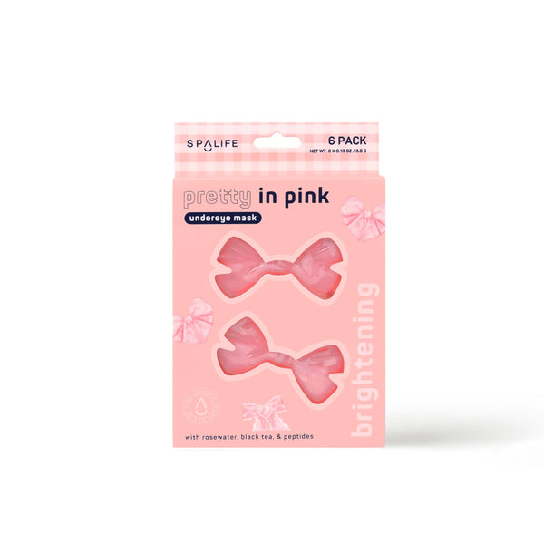 front view of the pretty in pink under-eye masks. shows the bow shape of them. also shows that they are pink. 