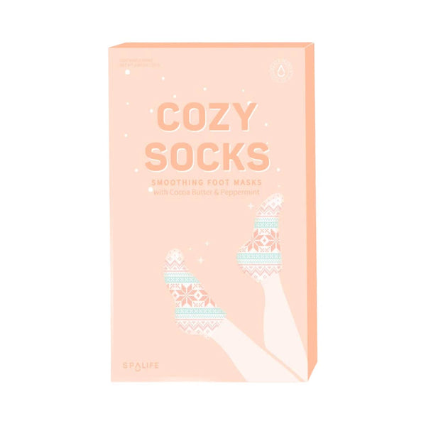 front view of the cozy socks. shows the front of the packaging with the print of the smoothing foot mask. 