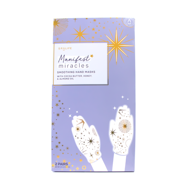 front view of the box of the manifest miracles hand masks. shows that there are 2 pairs in the box. also shows the gold star print on the hand masks and the periwinkle color packaging. 