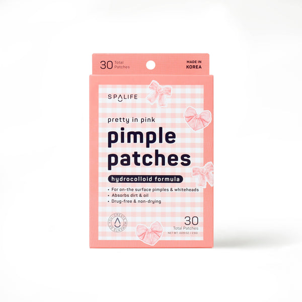 front view of the box of the pretty in pink pimple patches. shows the pink color with the pink plaid, the pink bows, shows that their are 30 patches in the box. 