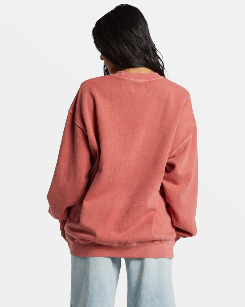 back view of the model wearing the ride in sweatshirt. shows the crew neckline. also shows the oversized fir, the ribbed bands and the dropped shoulders. 