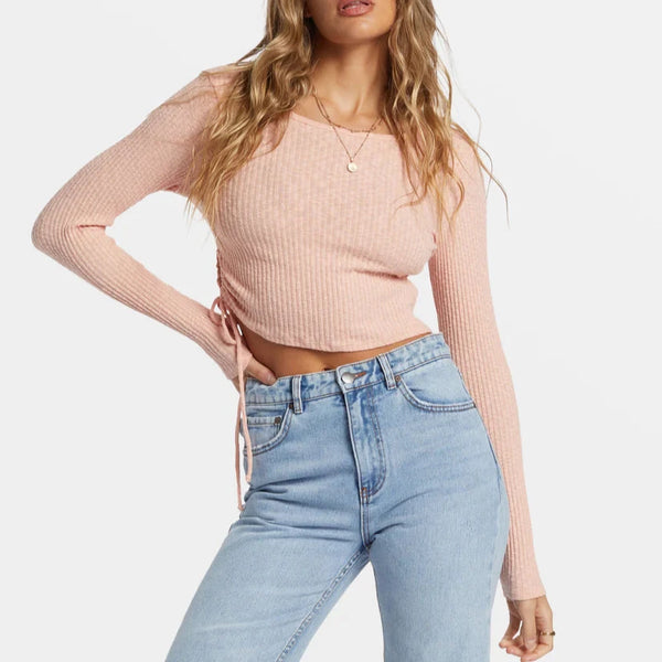 front view of the its a vibe long sleeve cropped top. shows the scoop neckline. also shows cropped fit, the side keyholes with a tie and ribbed detailing.