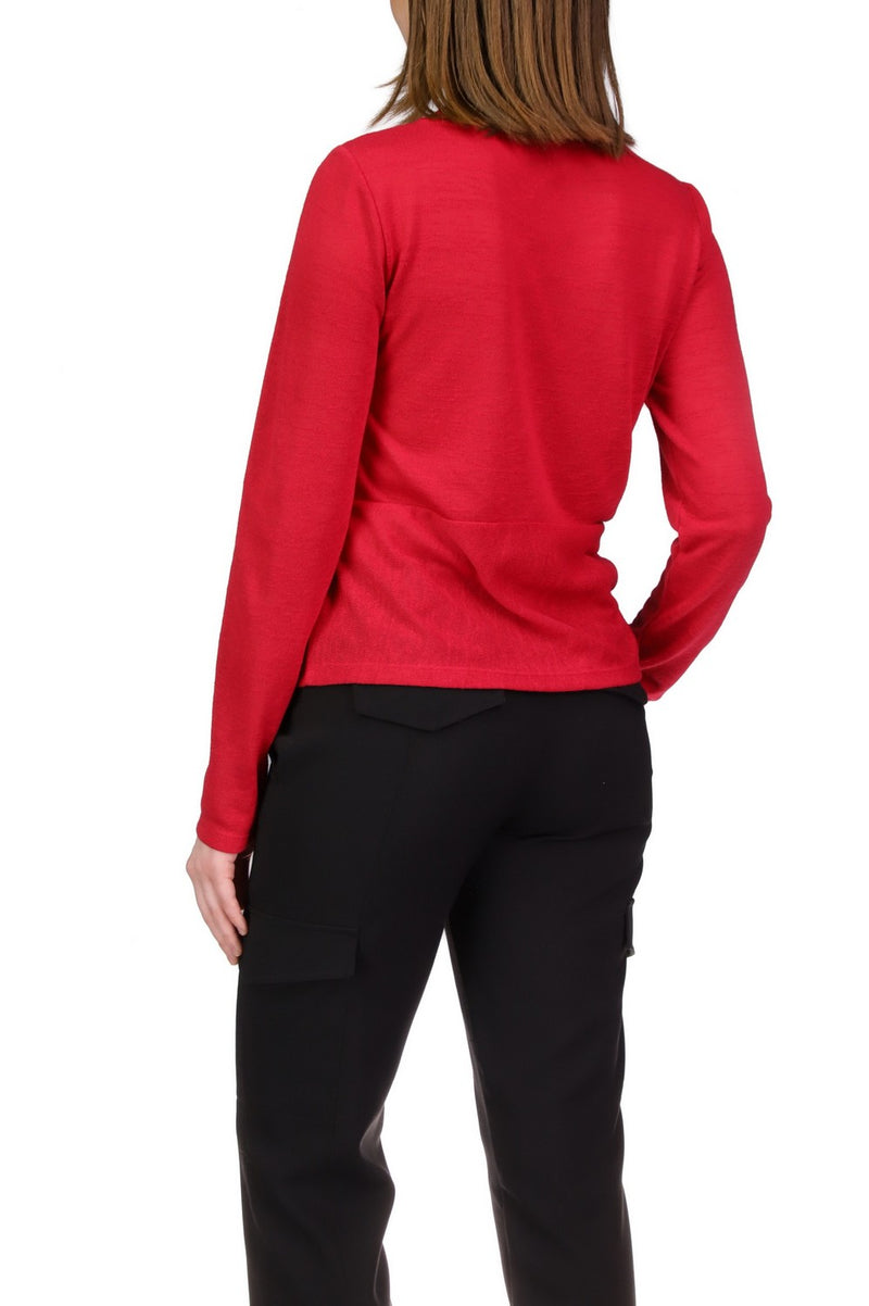 Back view of model wearing top. Shows the horizontal seam in the middle. Also shows the long sleeves.  