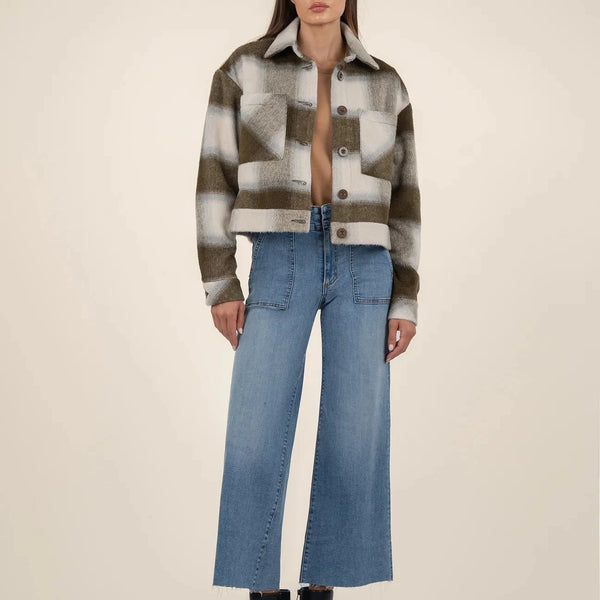 front view of the luciana crop jacket. shows the button down closure. also shows the dropped shoulders, the cropped length, the front patch pockets and the plaid pattern. 