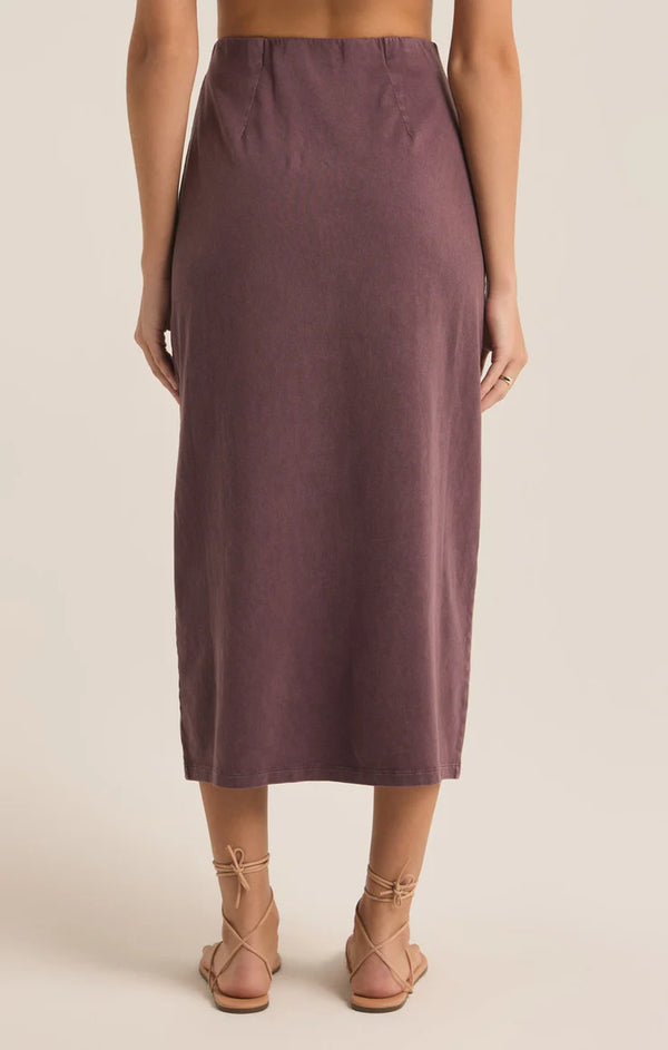 back view of the model wearing the shilo knit skirt. shows the midi length. also shows the high waist and the mineral wash. 