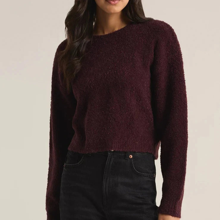 Front view of the model wearing the destiny sweater. shows the crew neckline. also shows the waist length and the dropped shoulders. This one is in this beautiful berry color. 