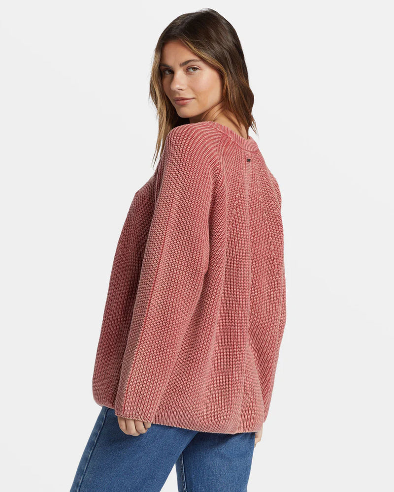 back/side view of the model wearing the addison sweater. shows the oversized fit. also shows the crew neckline, the raglan sleeves. 