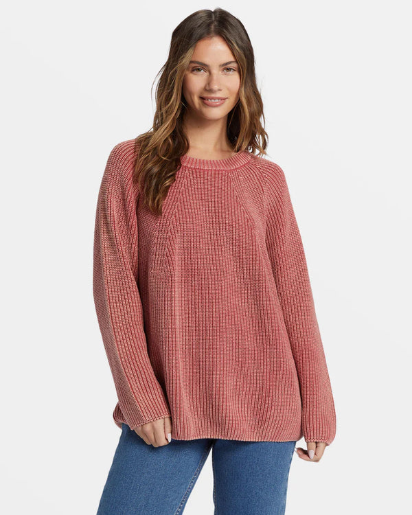 front view of the model wearing the addison sweater. shows the crew neckline. also shows the raglan sleeves, the oversized fit and the ribbed detailing. 