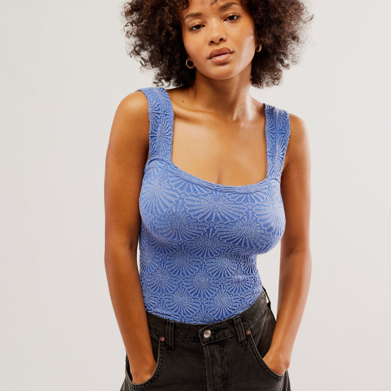 front view of the model wearing the love letter cami in Amparo blue. shows the square neckline. also shows the embossed print, the wide straps and slim fit. 