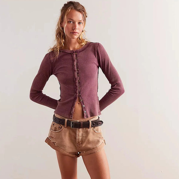 front view of the model wearing the its on cardi. shows the tight fitting sleeves. also shows the slim, relaxed fit, the front button down closure and the exposed seams. 