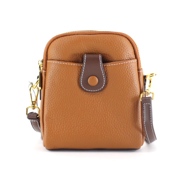 front view of the jane leather crossbody. shows the front pocket with the snap closure, the two zipper closures, the gold hardware, the brown crossbody strap, the caramel color body and the defined white stitching. 