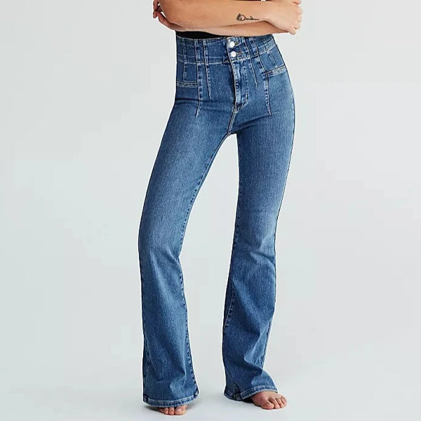 front view of the model wearing the jayde flare jeans. shows that they are super high rise. also shows the flared silhouette, the button fly, and the exposed yolking throughout.  