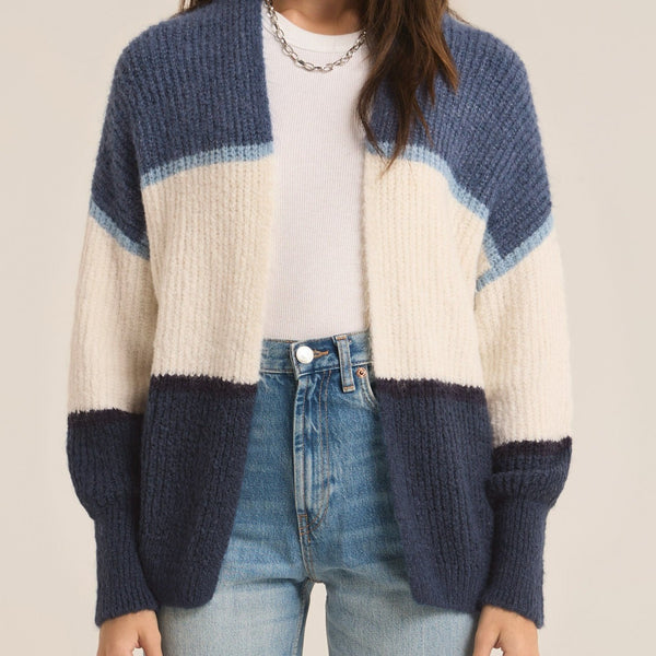 front view of the model wearing the jones stripe cardigan. Shows the open front. also shows the full blouson sleeves and the color blocking and ribbed detailing.  