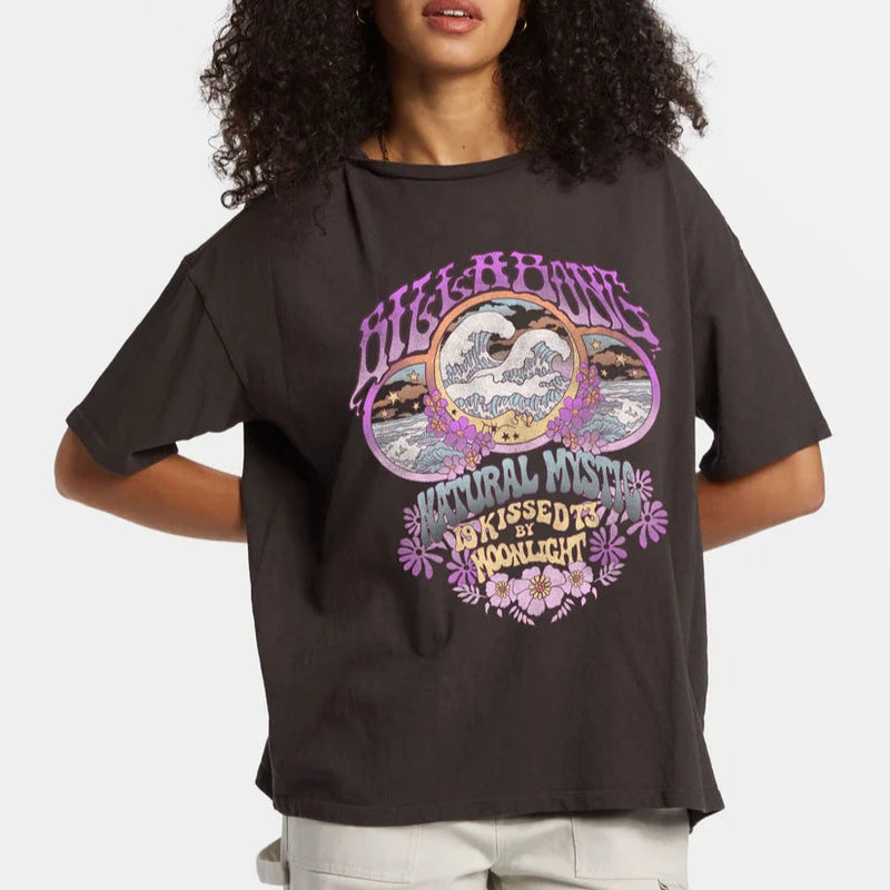 front view of the model wearing the natural mystic t shirt. shows the crew neckline. also shows the oversized fit, the front graphic, and the short sleeves. 