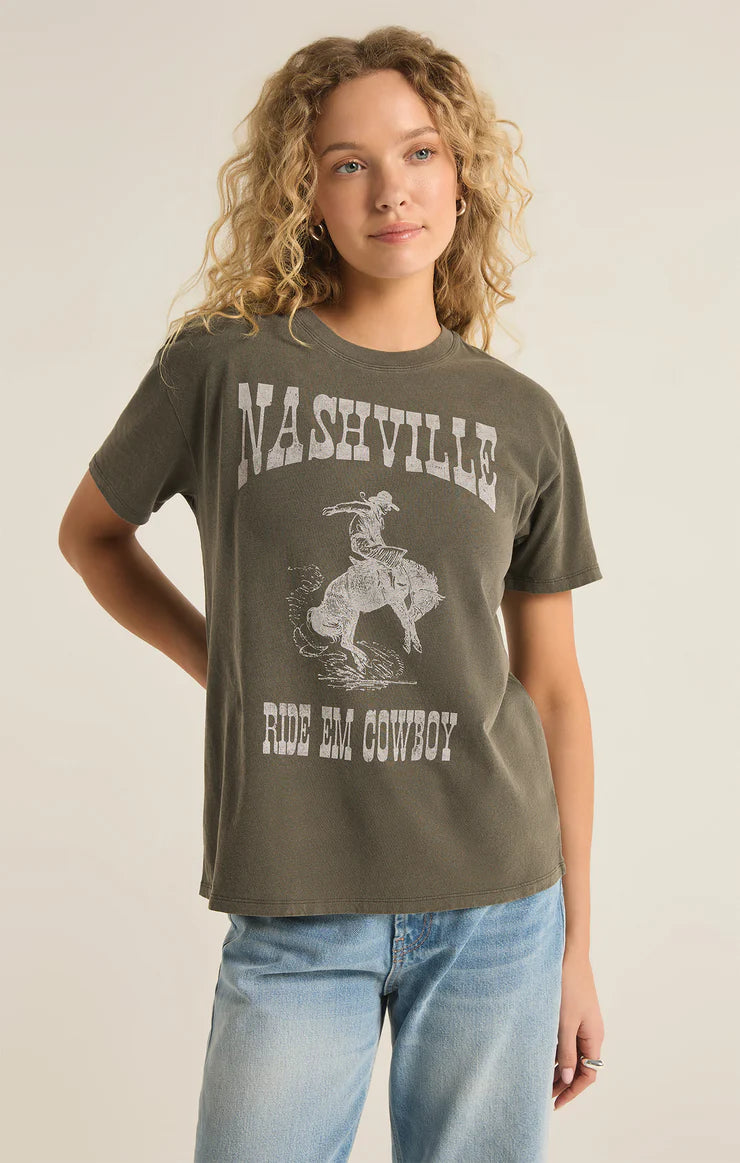 front view of the model wearing the Nashville boyfriend tee. shows the crew neckline. also shows the short sleeves, the front graphic and the relaxed fit. 