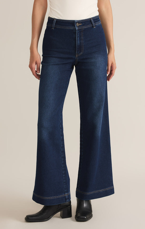 front view of the rilynn wide leg denim trousers. shows the high rise. also shows the button closure, the full length and the wide leg. 