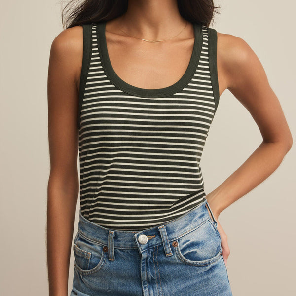 front view of the model wearing the elin stripe rib tank. shows the scoop neckline. also shows the green and white stripes, and the wide straps.