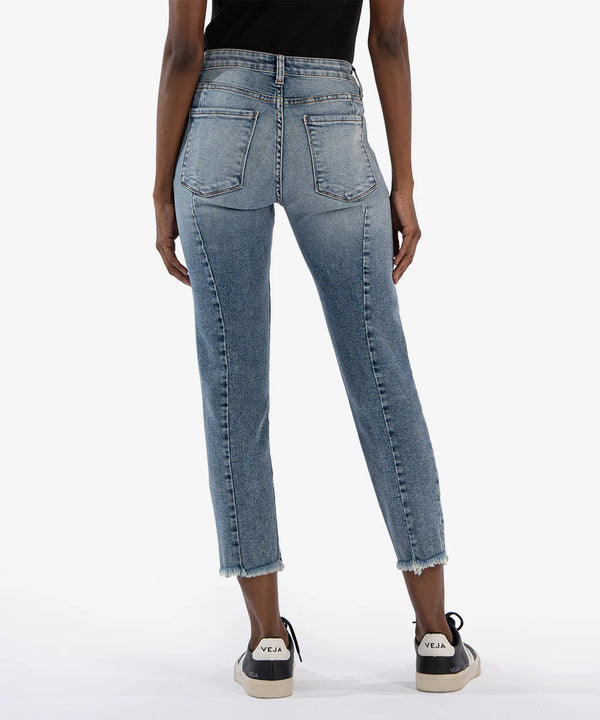 back view of the model wearing the rachael high rise fab ab ankle straight leg jeans. shows the back pockets. also shows the ankle length, the defined seaming down the leg and the frayed bottom hem. 