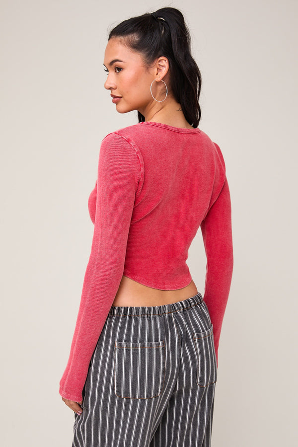 back view of the ellie long sleeve washed waffle crop top. shows the bottom curved hem. also shows the crop length and the long sleeves. 