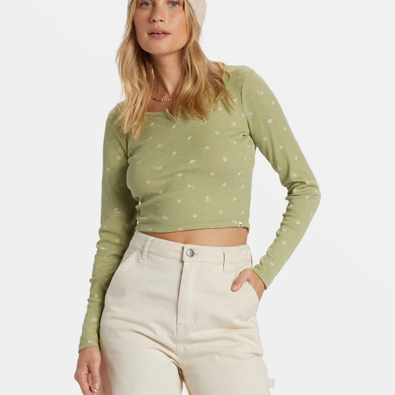 front view of the reese thermal. shows the flower detailing. also shows the fitted, cropped length. shows the scoop neckline with the notch at the neckline. 