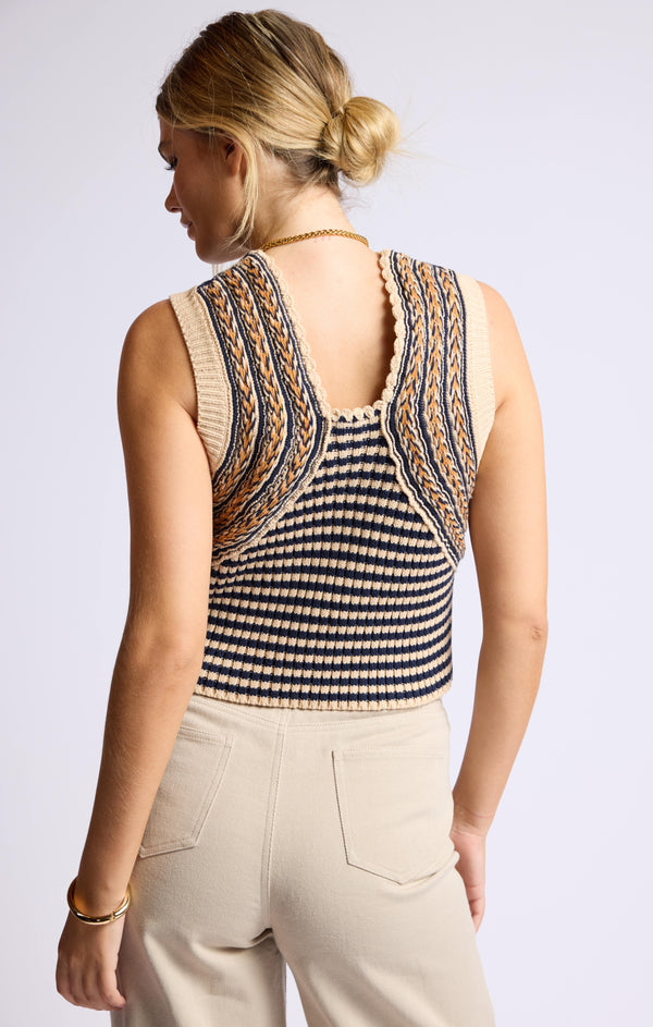 back view of the mona sweater tank. shows the detailed backing w/ a braided look. also shows the low neckline on the back, the horizontal stripes. 