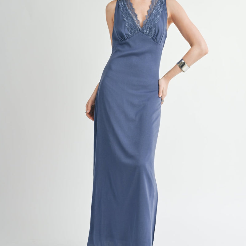 front view of the model wearing the write poetry lace contrast maxi dress. shows the v neckline. also shows the lace on the neckline, the thick straps, and the straight down silhouette.   