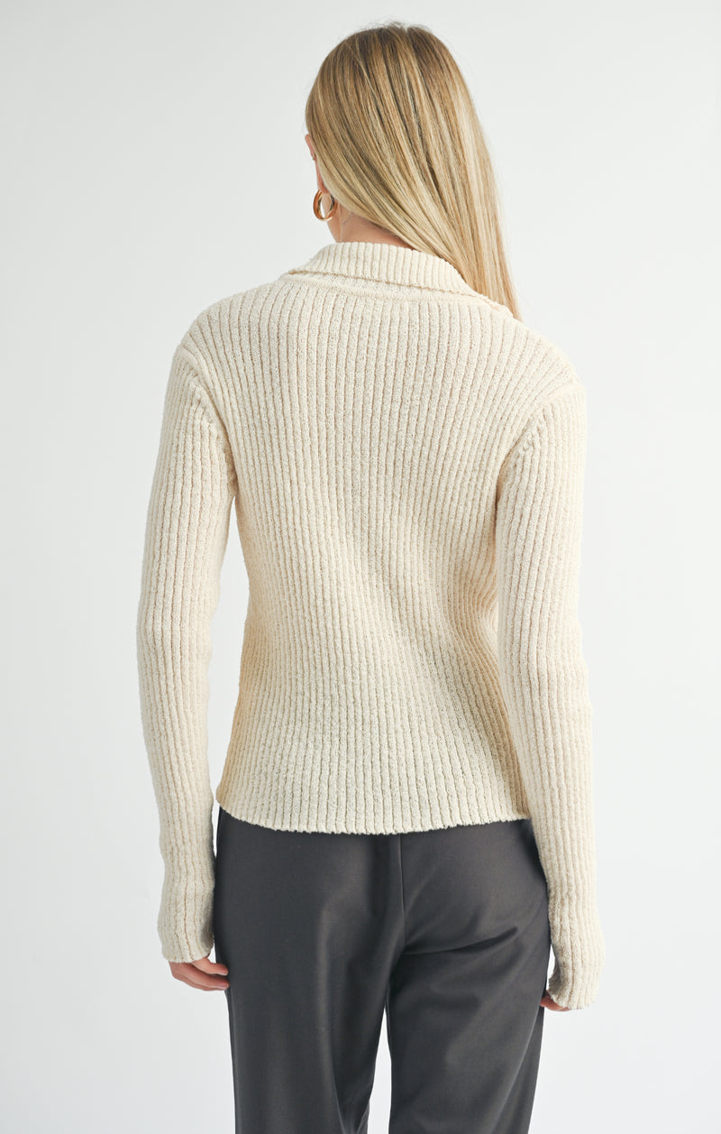 back view of the tori ribbed zip up cardi. shows the beautiful color ivory. also shows the ribbed detailing, the collar and the fitted style. 