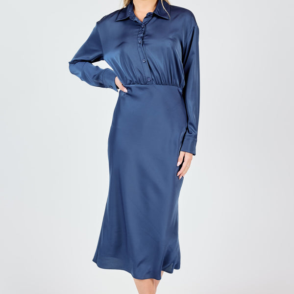 front view of the model wearing the last night shirt open back midi dress. shows the beautiful navy color. also shows the button down front, the midi length and the collar. 