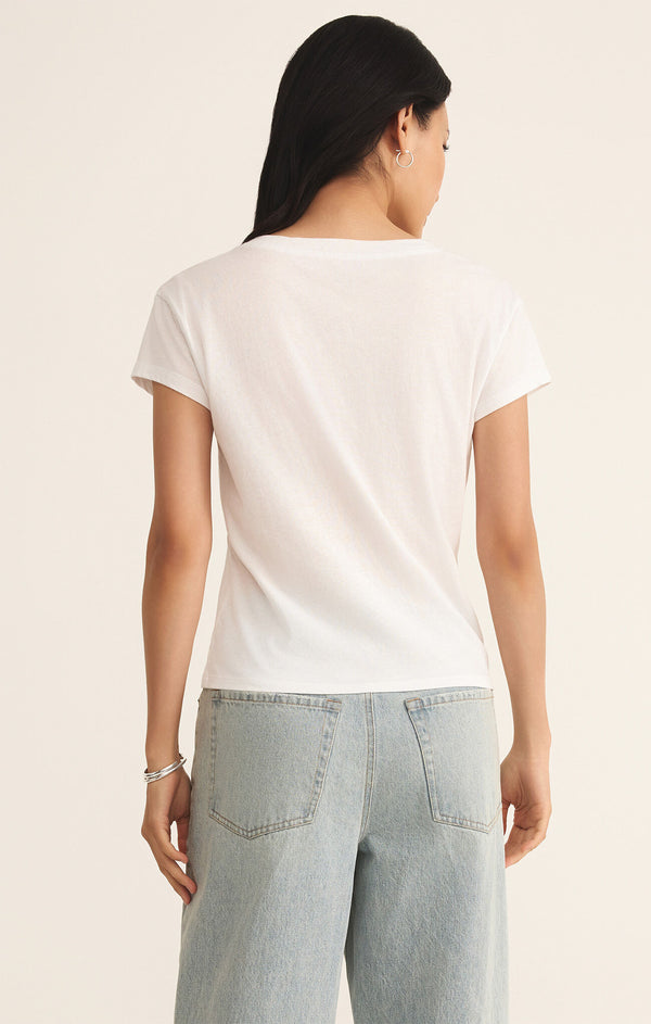 back view of the model wearing the modern v neck tee. shows the white color. also shows the short sleeve and the regular fit. 